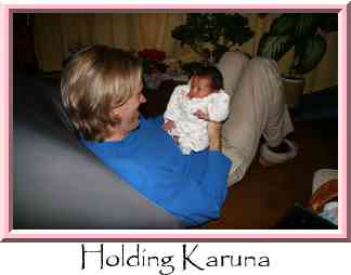 Holding Karuna Thumbnail